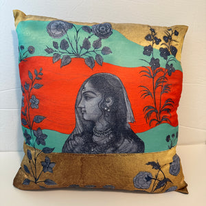 Decorative red and gold Mughal art cushion cover crafted from poly-silk, showcasing the original artwork of Sumaira Tazeen and blending traditional South Asian aesthetics with modern home decor.