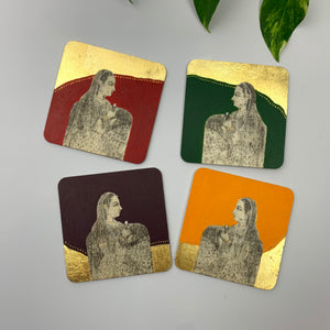 Four scattered hand-painted coasters spread out on a white surface to display different portraits inspired by miniature art and meticulous fine brushwork.