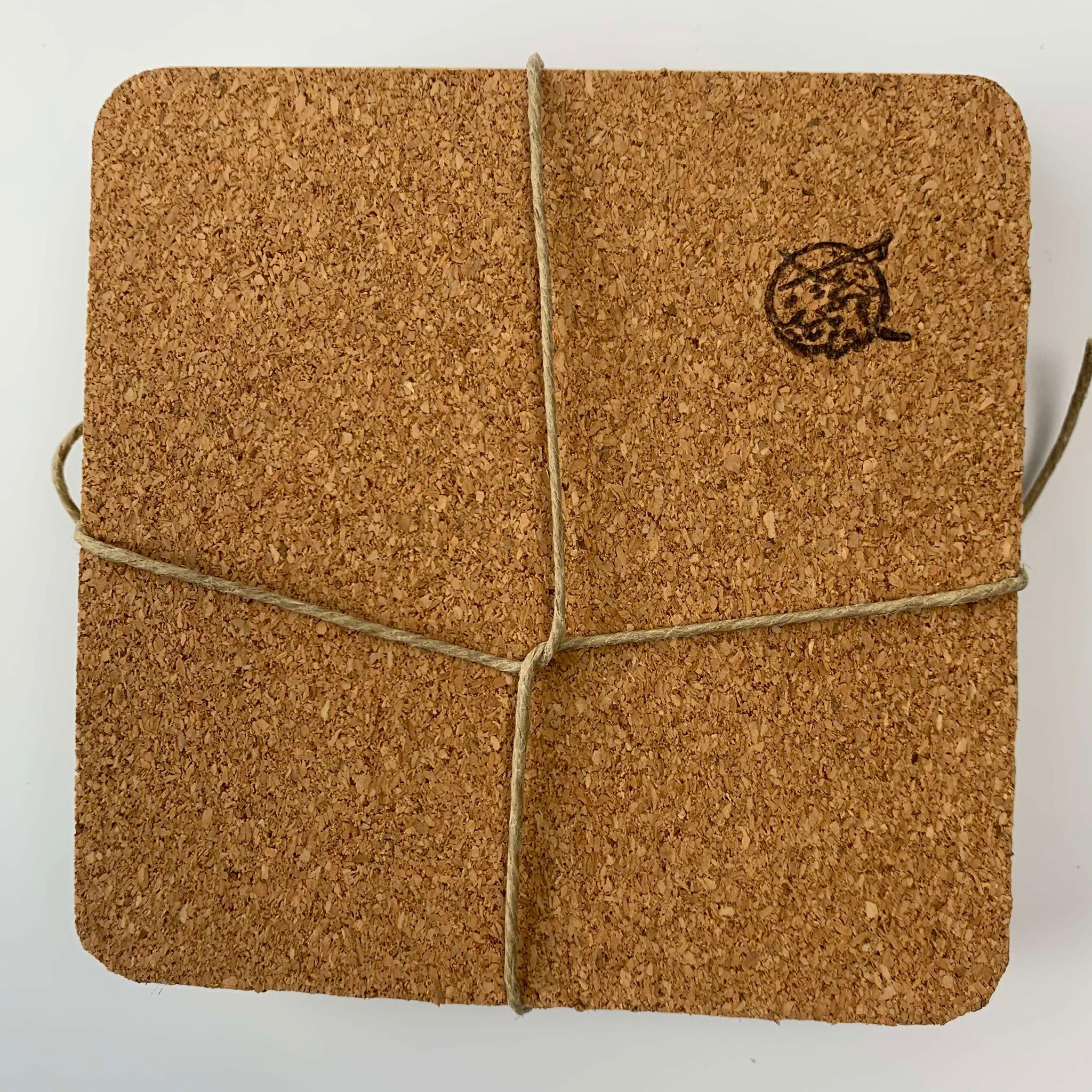 The reverse side of the artisan-made coasters featuring a soft cork sheet to protect furniture surfaces from scratches.