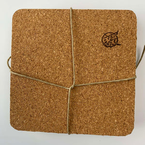 The reverse side of the artisan-made coasters featuring a soft cork sheet to protect furniture surfaces from scratches.