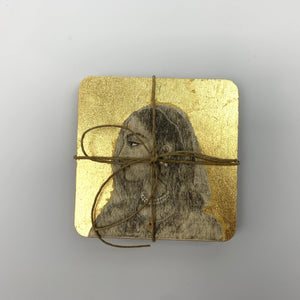 Top-down view of the Rani motif hand-painted coaster with gold leaf detailing, packaged as a set of four for gifting.