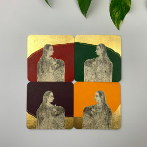 Four hand-painted coasters feature regal figures set against crimson, forest green, plum, and burnt amber backdrops, accented with gold leaf detailing.