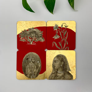A set of four handmade drink coasters featuring royal Raja and Rani portraits, a banyan tree, and floral motifs on a bright red and gold leaf background.