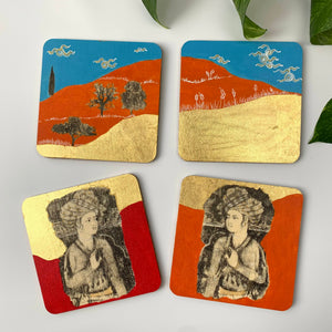 A set of four hand-painted coasters featuring Persian Prince motifs and gilded landscapes with orange, blue, and gold leaf backgrounds.