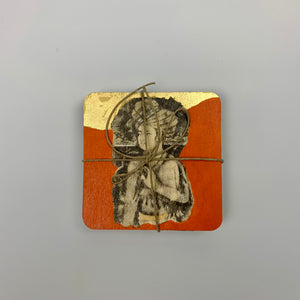 Top-down view of a tied set of four hand-painted coasters featuring a royal Persian figure on a vibrant orange and gold background.
